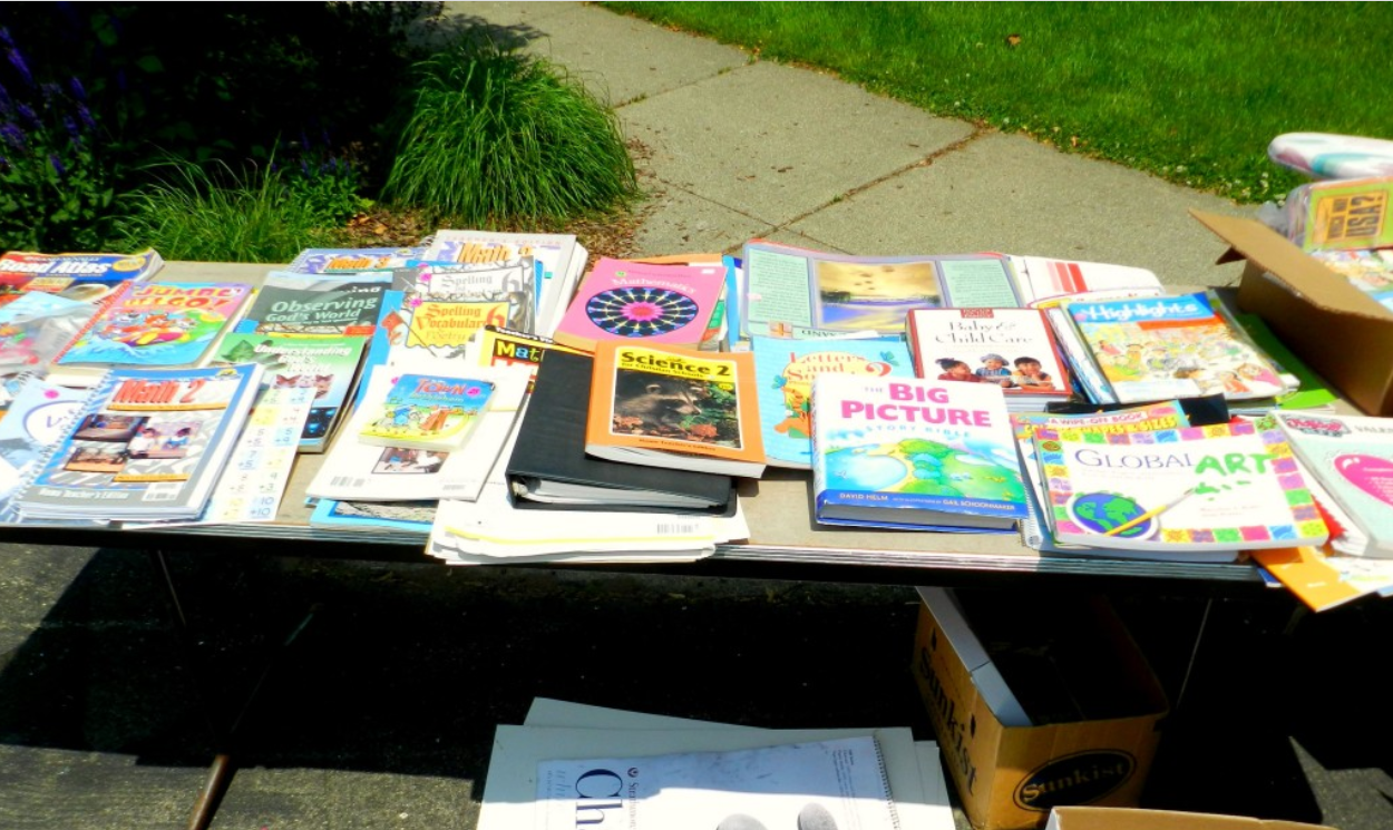 Collection of old books for sale on a table